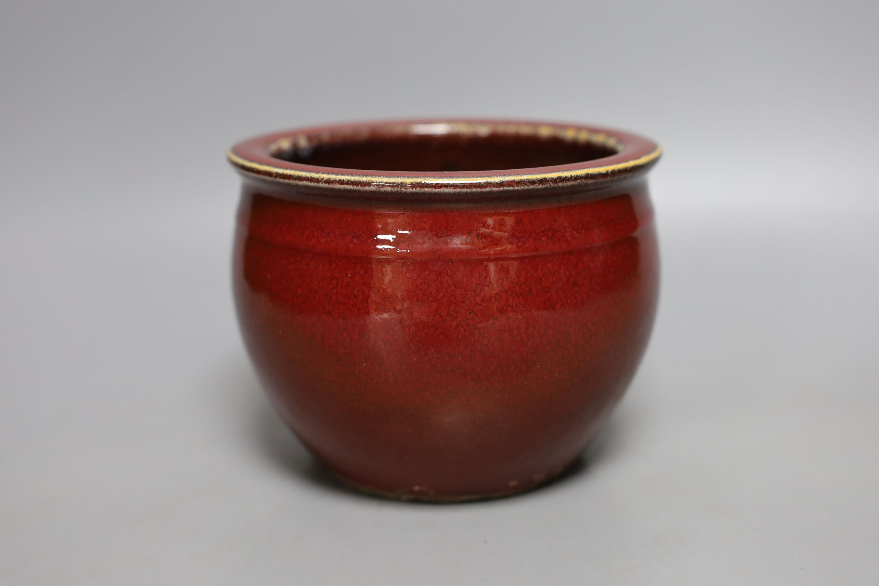 A Chinese sang de boeuf glazed jardiniere - 11cm tall
